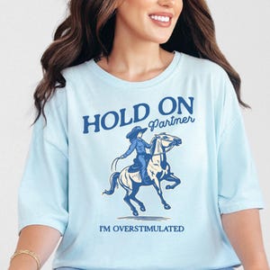 Hold On Partner I'm Overstimulated Shirt Comfort Colors Unhinged Shirts Weirdcore Clothing Vintage Cowgirl Aesthetic Funny Meme Shirt Chambray