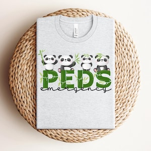 May include: A gray t-shirt with a green and black design featuring four pandas holding bamboo stalks. The text "PEDS emergency" is written in green below the pandas.