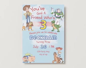 May include: A light blue birthday invitation featuring characters from the Toy Story movie. The invitation reads "You've Got A Friend Who's 3" with the name "Beckham" and the date July 26th. The invitation includes the time 1 PM and the address.