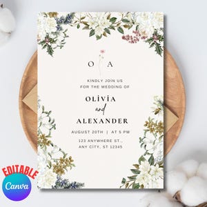 May include: Wedding invitation with floral decorations of white flowers and foliage. The invitation includes the names Olivia and Alexander, the wedding date and time. The text reads "Kindly join us for the wedding of".