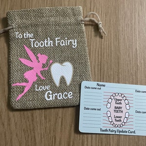 May include: A beige burlap tooth fairy bag with a pink fairy design, a white tooth, and the text "To the Tooth Fairy Love Grace." A small card with a tooth chart and spaces to record tooth loss dates is also included.