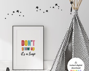 May include: A framed print with the words "DON'T grow up it's a trap" in colorful letters. A black and white polka dot teepee stands to the right, with black star decals on the white wall. A digital download icon is in the lower right.