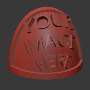 May include: A reddish-brown, shield-shaped object with the words "YOUR IMAGE HERE" carved into its surface. The text is in a bold, sans-serif font. The object has a rounded top and a flat base, set against a dark gray background.