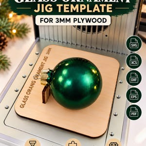 May include: A laser-cut plywood jig template for 3mm plywood, designed for glass ornaments. The wooden base features the text GLASS ORNAMENT JIG 3MM. Includes file format icons for SVG, XCS, DXF, EPS, and PDF, with labels for xTool compatibility.