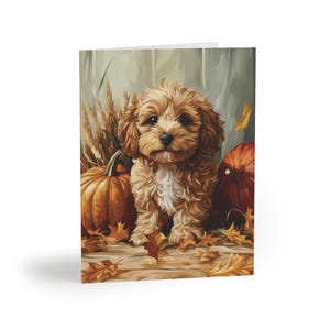 May include: A brown and white puppy dog sits in a pile of autumn leaves with two pumpkins. The dog has a sweet expression on its face.
