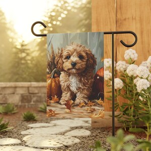 May include: A brown and white puppy dog sits in a fall scene with pumpkins and autumn leaves. The dog is looking directly at the viewer. The scene is painted in a realistic style.