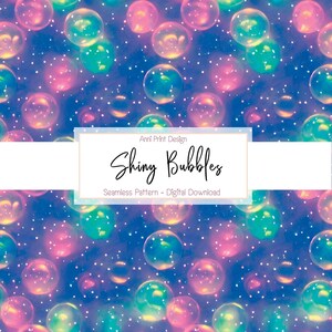 Könnte beinhalten: Ein nahtloses Muster mit schillernden Blasen in Rosa-, Blau- und Grüntönen auf einem dunkelblauen Hintergrund mit weißem Glitzer. Der Text "Anni Print Design" und "Shiny Bubbles" wird in einem weißen Banner angezeigt.