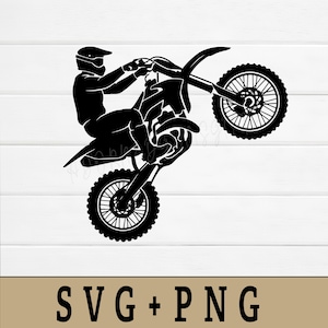 May include: Black silhouette of a person riding a motocross bike in a wheelie position. The rider is wearing a helmet and riding gear. The image includes the text "SVG + PNG" at the bottom.