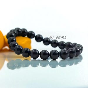 Pulsera elástica de turmalina negra natural con cuentas de 8 mm, de alta calidad, redonda y lisa, ideal como regalo.