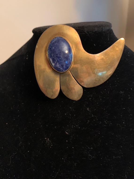 Signed Florelle brass brooch with sodalite stone.