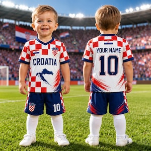 A young boy wearing a red and white Croatia soccer jersey with the number 10, standing on a soccer field.