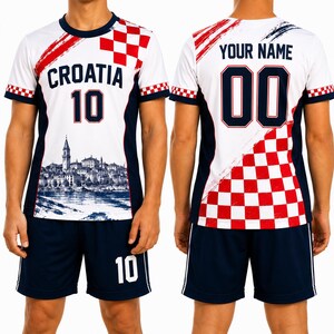 A white and red soccer jersey with the word "Cratia" printed on it, along with the number 10. The jersey also has a checkered pattern on the back.