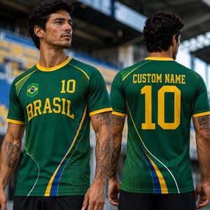 A man wearing a green and yellow soccer jersey with the number 10, standing in front of a stadium.