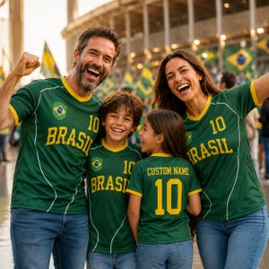 A family of four, two men and two women, are wearing green and yellow Brazil soccer jerseys and smiling at the camera.