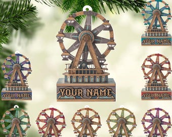 May include: A collection of Ferris wheel ornaments in various colors, including blue, red, green, and purple. Each ornament has the text "YOUR NAME" on the base. The ornaments are made of wood and have a vintage, carnival-like design.