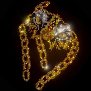 May include: A gold chain with a tiger head pendant made of sparkling rhinestones. The chain and pendant are made of small, glittering rhinestones in gold and silver tones.