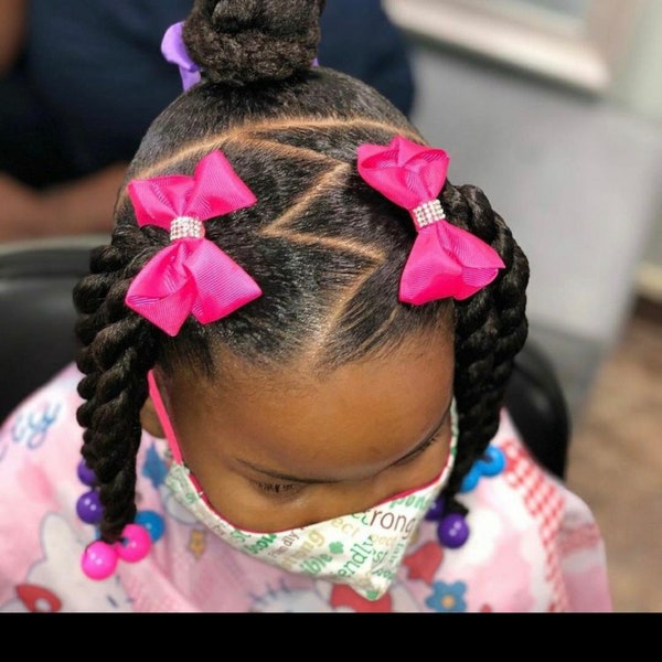 Kids braided ponytail extensions with beads, clip bows, and adjustable bands. Twists and braids ponytails clip and go