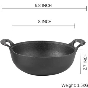 May include: A black cast iron pan with two loop handles. The pan is 9.8 inches wide, 8 inches in diameter, and 2.7 inches deep. It weighs 1.5 kg.