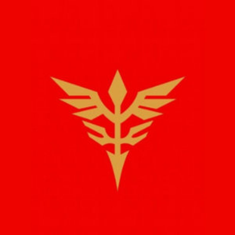 Pode incluir: Um emblema dourado com um design estilizado que se assemelha a um p&aacute;ssaro com as asas abertas e uma ponta de lan&ccedil;a no topo. O emblema est&aacute; sobre um fundo vermelho.