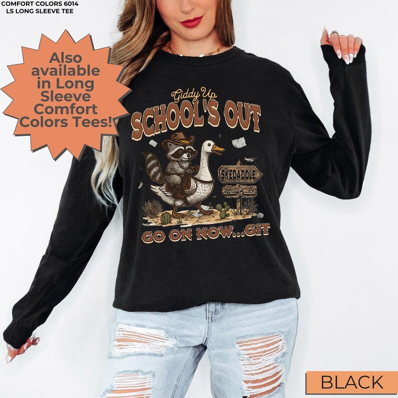 May include: Black long-sleeve tee with a graphic featuring a raccoon riding a goose, cacti, and the text "Giddy Up School's Out". The tee also has the text "Skedaddle" and "Go on now...Git".
