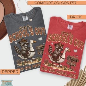 May include: Two Comfort Colors t-shirts, one pepper and one brick, feature a graphic of a raccoon riding a goose with the text "Giddy Up School's Out". The shirts also have the text "Go on now...Git" and "Skedaddle 4th Grade".