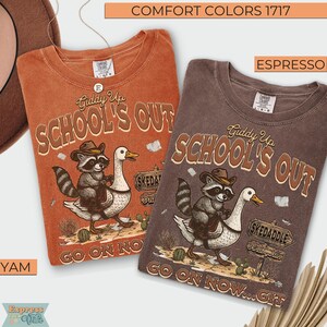 May include: Two Comfort Colors t-shirts, one in Yam and the other in Espresso. Each shirt features a graphic of a raccoon riding a goose with the text "Giddy Up School's Out" and "Go On Now...Git".