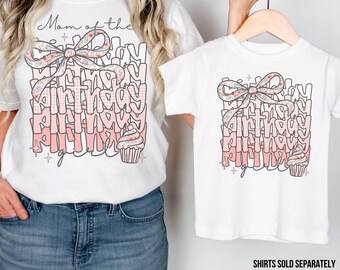 May include: White t-shirts with a pink and white birthday design. The adult shirt says "Mom of the Birthday Girl" and the toddler shirt says "Birthday Girl".