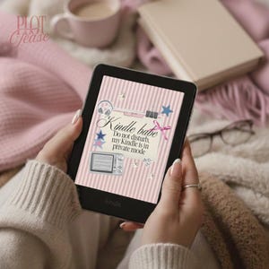 May include: A black Kindle e-reader showing a pink and white striped design with the words "Kindle babe". The screen includes star and headphone graphics. The text "Do not disturb, my Kindle is in private mode" is also visible. The e-reader is held in a person's hands.