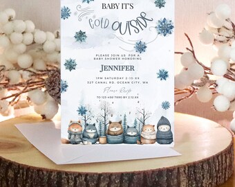May include: Baby shower invitation with a winter theme. The invitation features a watercolor background with snowflakes and the text "Baby It's Cold Outside". The invitation also includes a cute illustration of woodland animals wearing winter clothes.