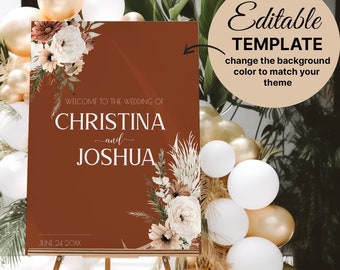 May include: A brown welcome sign with white floral accents and the text "Welcome to the wedding of Christina and Joshua" with the date "June 24 20XX". The sign is on an easel in front of a backdrop of white and gold balloons.