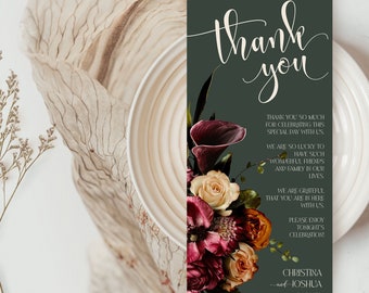 May include: A dark green thank you card with a floral design featuring burgundy, peach, and cream flowers. The text reads "To our family & friends, thank you. Thank you so much for celebrating this special day with us. We are so lucky to have such wonderful friends and family in our lives. We are grateful that you are here with us. Please enjoy tonight's celebration! Christina and Joshua 00.24.XX"