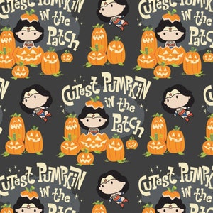 May include: A black and orange Halloween themed fabric with a repeating pattern of Wonder Woman characters dressed as pumpkins. The text "Cutest Pumpkin in the Patch" is repeated throughout the fabric.