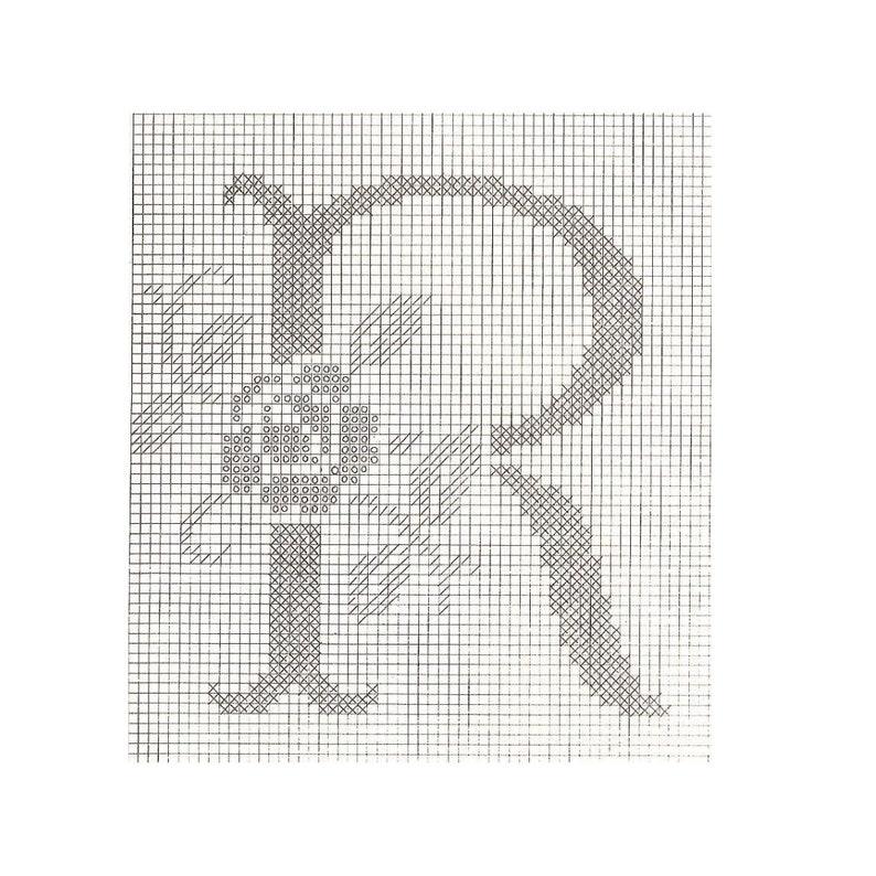 May include: Black and white cross-stitch pattern of the letter R with a small flower design in the center.