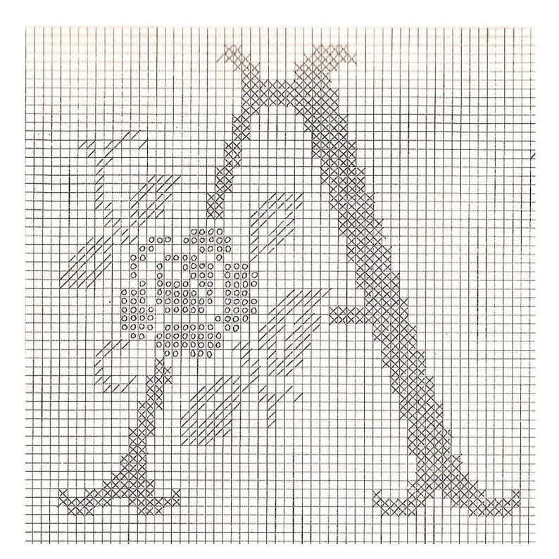 May include: Black and white cross stitch pattern of the letter A with a flower design. The pattern is on a grid with squares.