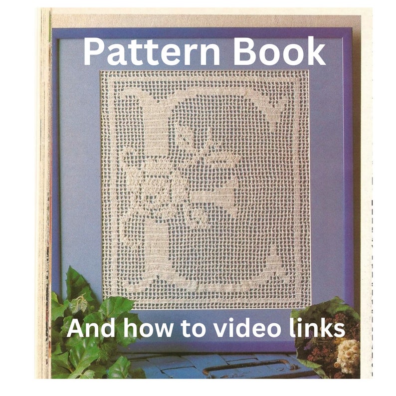 May include: A framed image of a crocheted letter "E" with a blue background. The frame is blue and the text "Pattern Book" and "And how to video links" is printed below the image.