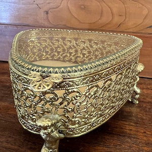 Vintage Ormolu and beveled glass box with cherub feet