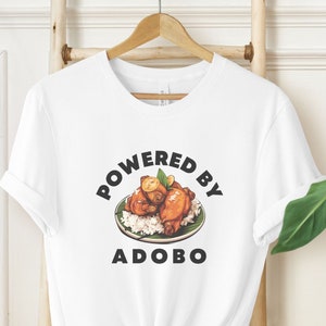 Unisex Powered By Adobo T-Shirt, Iconic Savory Filipino Dish Tee, Gift for Filipino Food Lover or Foodie, Pinoy Cuisine and Culture Shirt