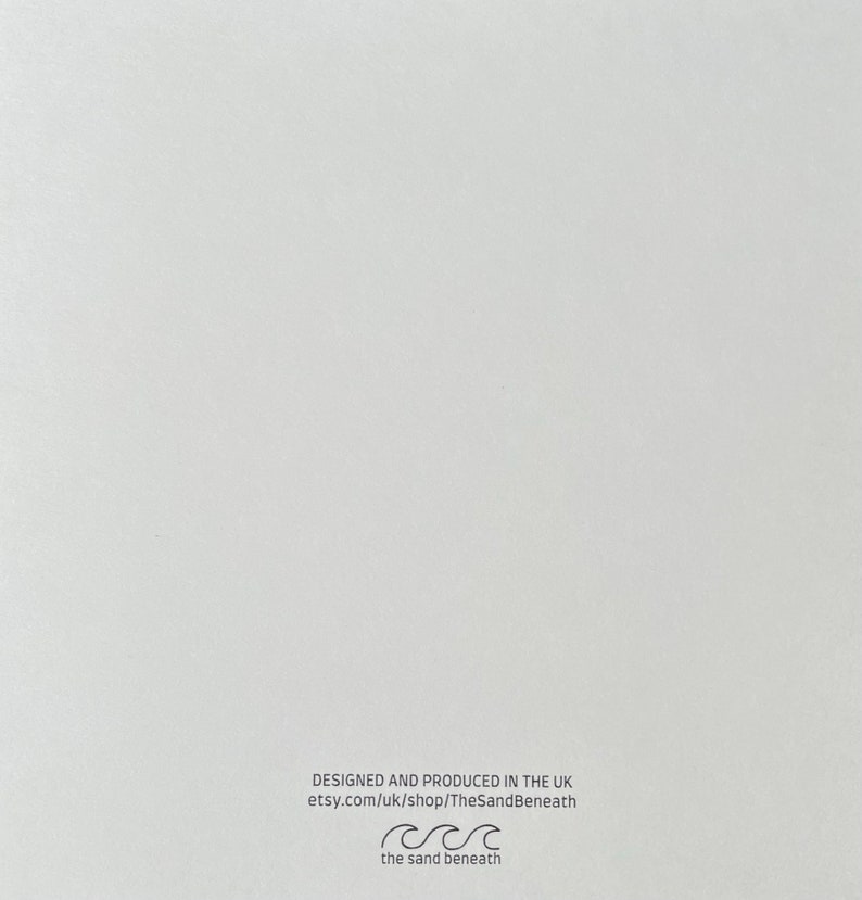May include: White card with black text that reads "Designed and produced in the UK etsy.com/uk/shop/TheSandBeneath the sand beneath" with a wave symbol.
