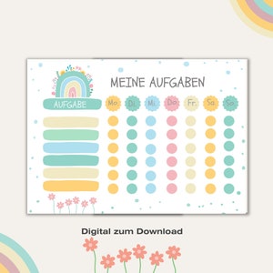 以下が含まれることがあります： パステルカラーのタスクチャート。虹と花の模様が特徴です。チャートにはドイツ語の「MEINE AUFGABEN」と「AUFGABE」の文字、タスクと曜日用のスペース、そして「Digital zum Download」の文字が含まれています。