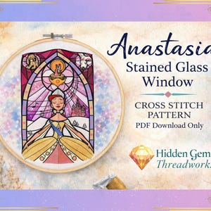 May include: A cross-stitch pattern featuring a stained glass window design with the word "Anastasia" at the top. The design is in a wooden embroidery hoop. The text "Cross Stitch Pattern PDF Download Only" is also included.