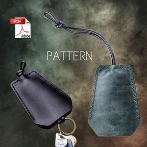May include: A PDF pattern for a leather key fob. The pattern includes two different styles, one in black leather and one in green leather. The pattern is for a key fob with a loop for attaching keys.