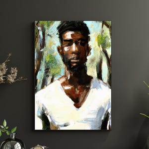 May include: An oil painting on canvas depicts a person with dark skin wearing a white v-neck shirt. The background features a blurred forest scene with green and blue hues. The artwork is displayed on a dark gray wall.