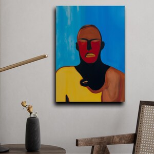 May include: Abstract portrait painting featuring a figure with a red face and yellow shirt against a blue background. The artwork has bold colors and a modern aesthetic, suitable for home decor.