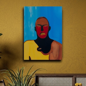 May include: Abstract portrait painting on canvas. The artwork features a figure with a red face, brown hair, and a yellow shirt against a blue background. The painting is mounted on a mustard-colored wall.
