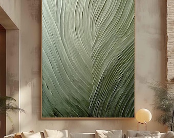 May include: Large framed abstract art piece featuring a textured, layered design in shades of green. The artwork has a leaf-like pattern with a light green to dark green gradient. The frame is a light brown color.