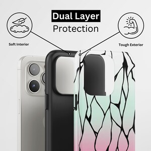 May include: A dual-layer phone case with a soft interior and tough exterior. The case features a black and white design with pink and green accents. The text "Dual Layer Protection" is displayed on the case.