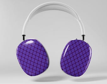 May include: White over-ear headphones with earcups featuring a purple plaid pattern. The headband is white, and the earcups are connected to the headband with black joints. The headphones are shown against a light gray background.
