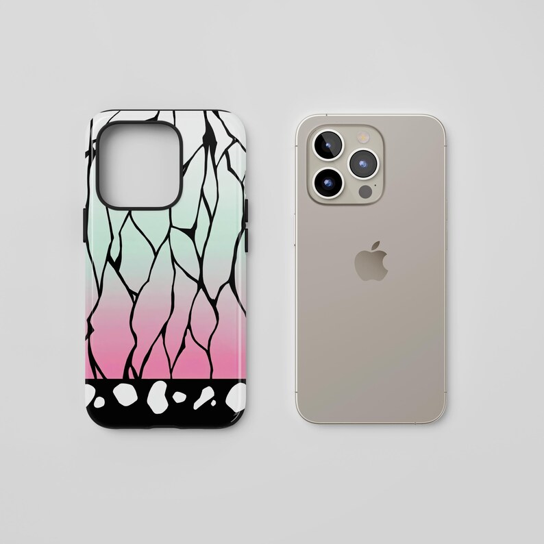 May include: A smartphone case with a colorful design. The case features a gradient of colors, transitioning from light green to pink, with black lines and white dots. Next to it is a silver smartphone.