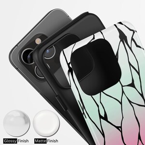 May include: Three smartphones with protective cases. The case on the front has a white, green, and pink design with black lines. The image also shows two finish options: Glossy and Matte.