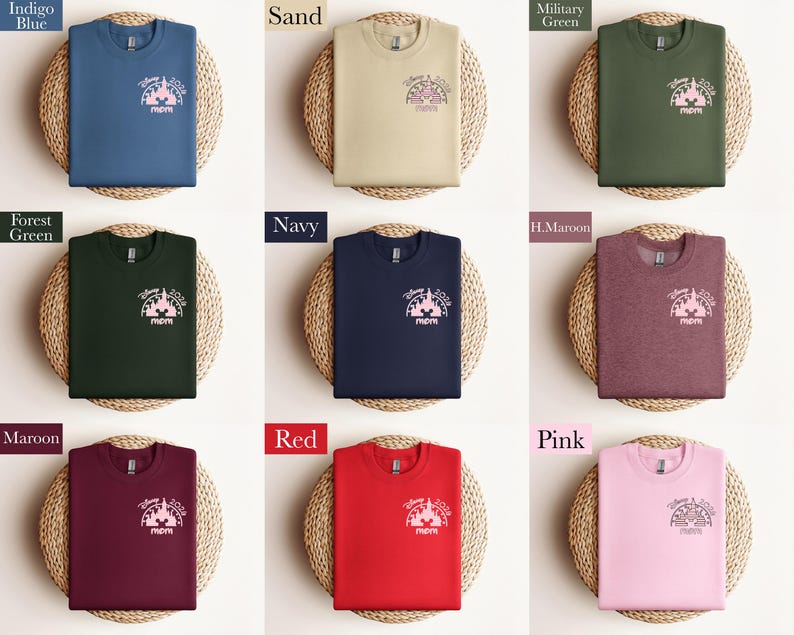 May include: A collection of crewneck sweatshirts in various colors, including indigo blue, sand, military green, forest green, navy, maroon, red, and pink. Each sweatshirt features a graphic of a castle and the word "mom".